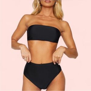 Woman’s black bathing suit bottoms